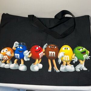 M&M's World graphic tote bag featuring several M&M's characters.